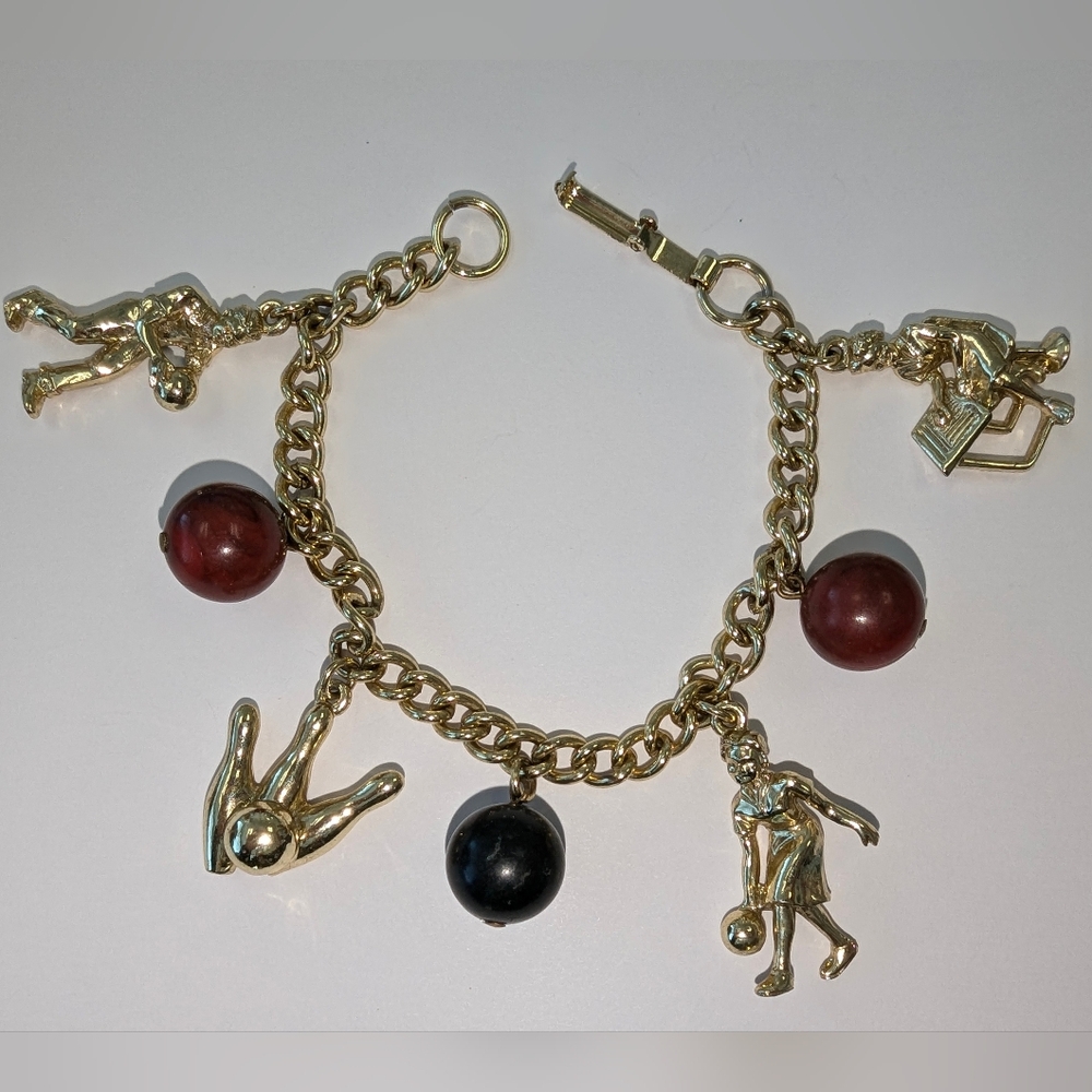 EVC GOLD TONE BOWLING BRACELET